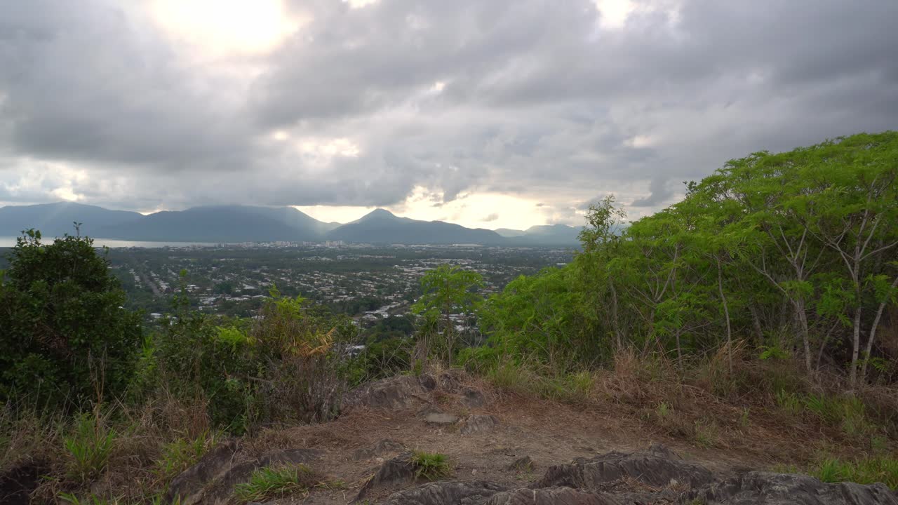 Man walking in from right hand side to look at view.