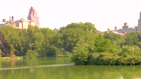 central park, manhattan, new york lake view with cityscape