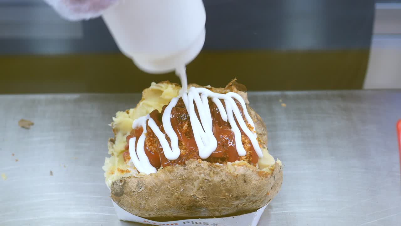 Preparing a Baked Potato with Sauces
