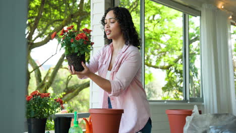 potting flowers at home, woman gardening with smile on face