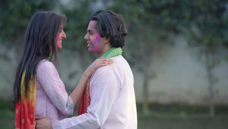 romantic indian couple enjoying holi festival