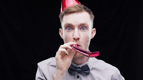 Geek-man-red-party-blower-slow-motion-photo-booth