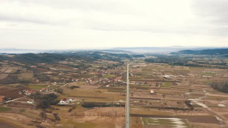 A-free-road-between-two-villages,-Drone-4K-colored