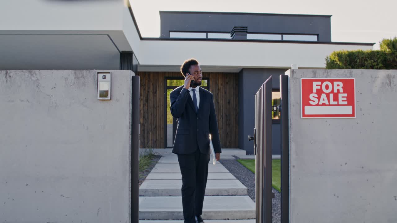 Real Estate Agent Showing House For Sale