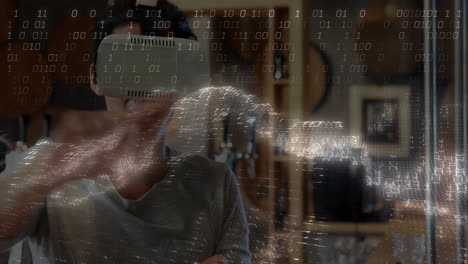 man wearing vr headset manipulating holographic globe in technology lab, displaying binary code