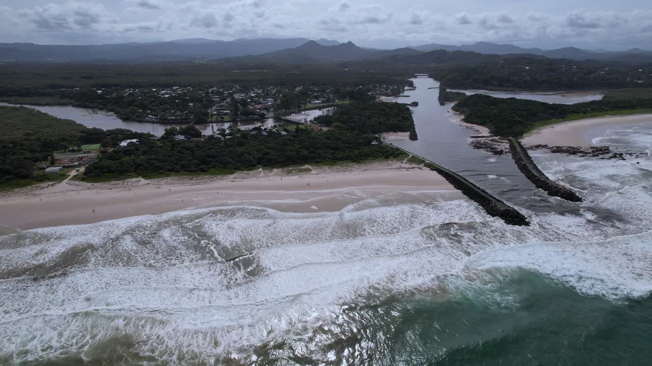 Brunswick Heads Main Beach With Brunswick River Mouth Flanked By Rock Walls In New South Wales, Australia. aerial shot