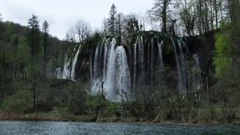 handheld shot of large waterfall in plitvice lakes national park, croatia
