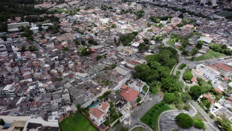 Aerial-view-overlooking-the-contrast-between-slums-and-the-rich,-in-Sao-Paulo,-Brazil---circling,-drone-shot