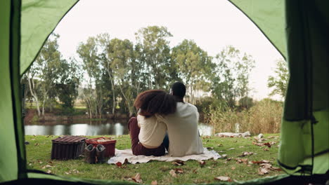 camping, tent and back of couple hug for bonding