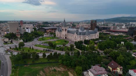 drawback drone footage of iasi's palace of culture and surrounding cityscape