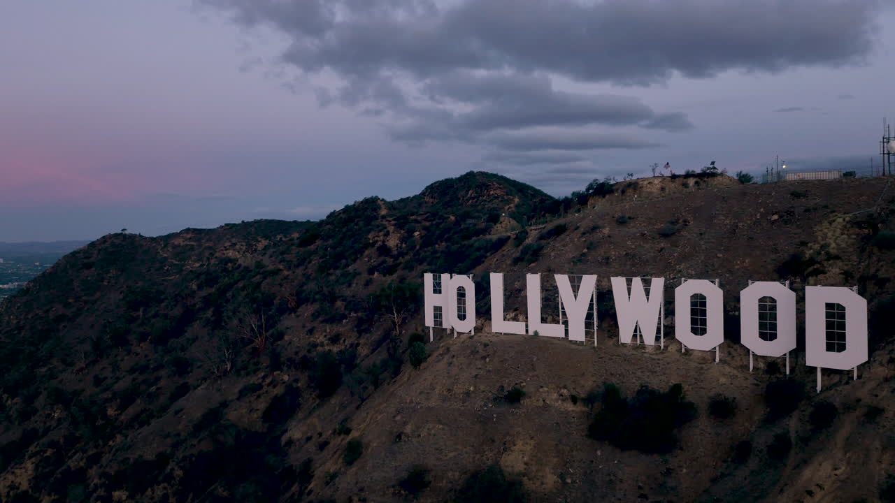 The iconic Hollywood Sign on a hill at dusk