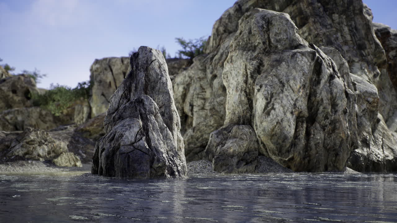 Natural rock formation rising from calm water in a serene landscape