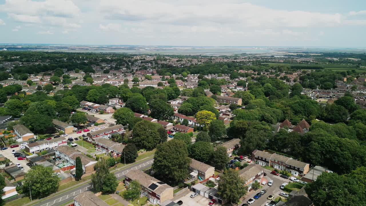 Drone aerial flyover of Medway residential grid with treelined roads and parks
