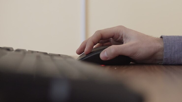 Hand clicking computer mouse
