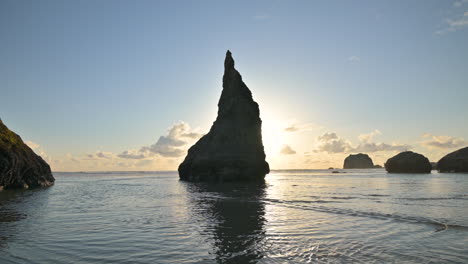 silhouetted wizards hat rock formation oregon coast, usa