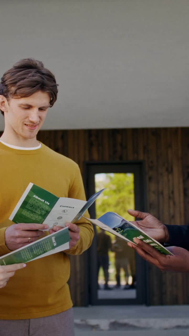 Real Estate Agents Discussing Brochures