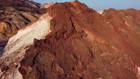 Scenic-landscape-of-mineral-material-mountain-mining-industry-and-recreation-adventure-activity-tourism-in-coastal-beach-the-rainbow-mountain-rocky-formation-in-Iran-Natural-landscape-wonderful-hiking