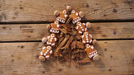 Gingerbread-cookies-and-cinnamon-sticks-forming-christmas-tree-4k
