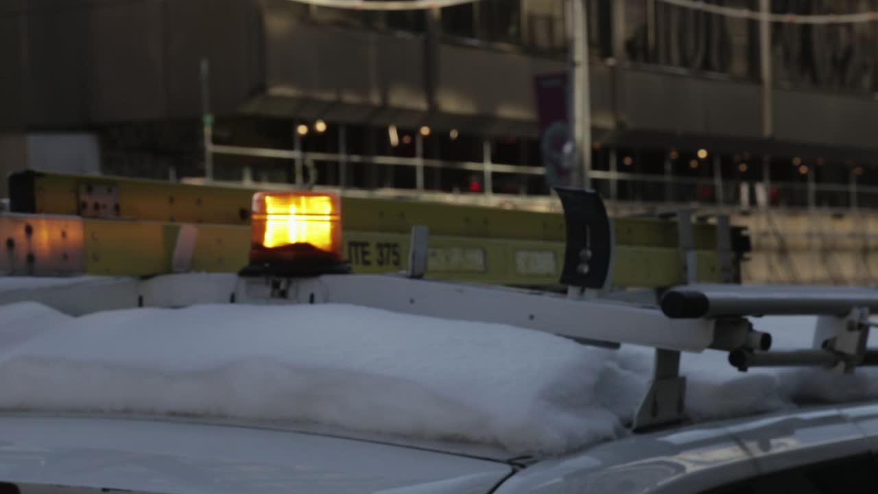 Police Car Light Bulb Flickering On A Cold Winter Day - Close Up Shot