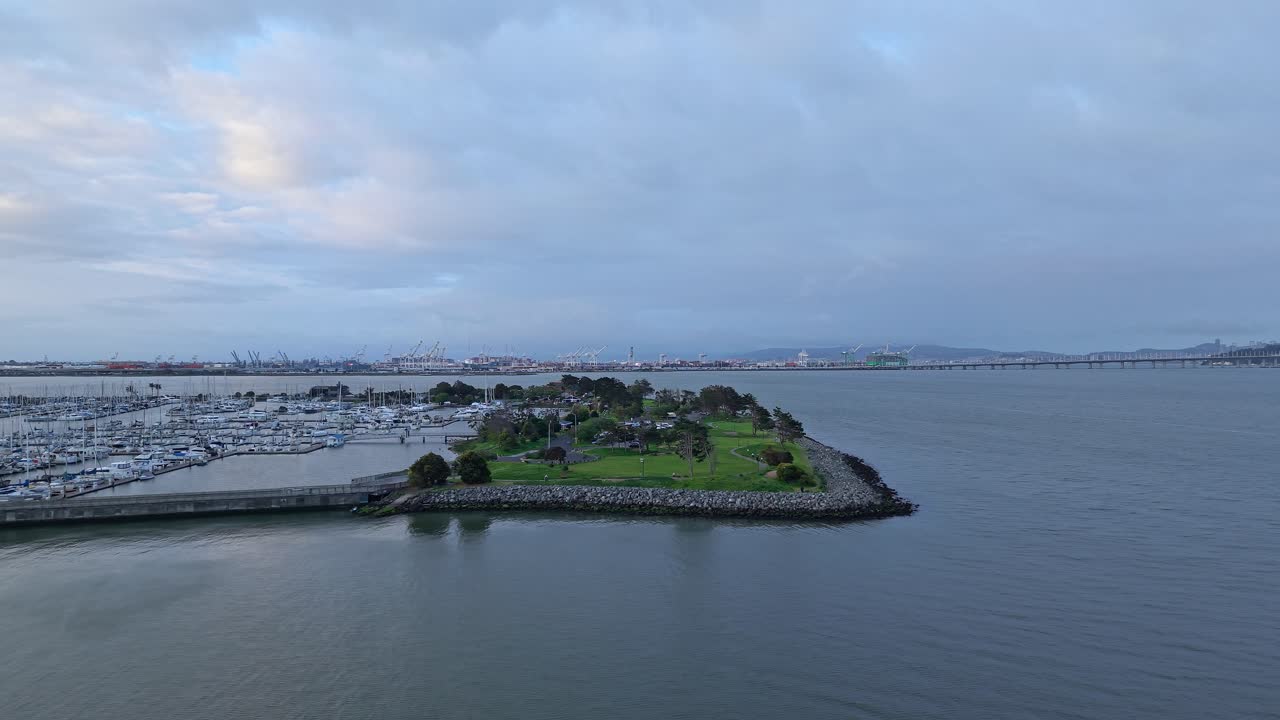 Smooth drone panning follows the curve of Emeryville Marina Park, revealing its stunning bayfront landscape.