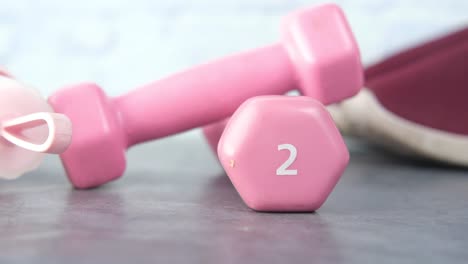 pink dumbbells for exercise