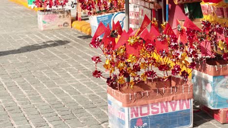 vibrant flowers and flags at a temple market