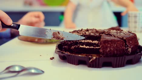 a man puts a piece of cake on a plate