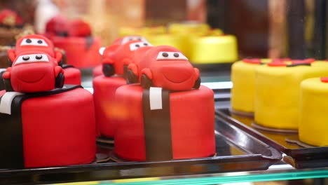 colorful mini cakes with toy car decorations