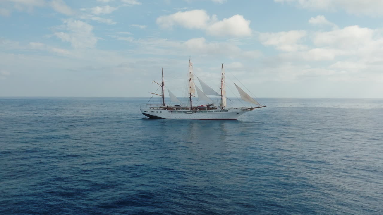 Sea cloud luxury cruise ship sailing vessel in the Atlantic Ocean under clear blue sky, Aerial
