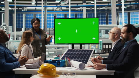 solar panels plant manager uses isolated screen monitor during presentation