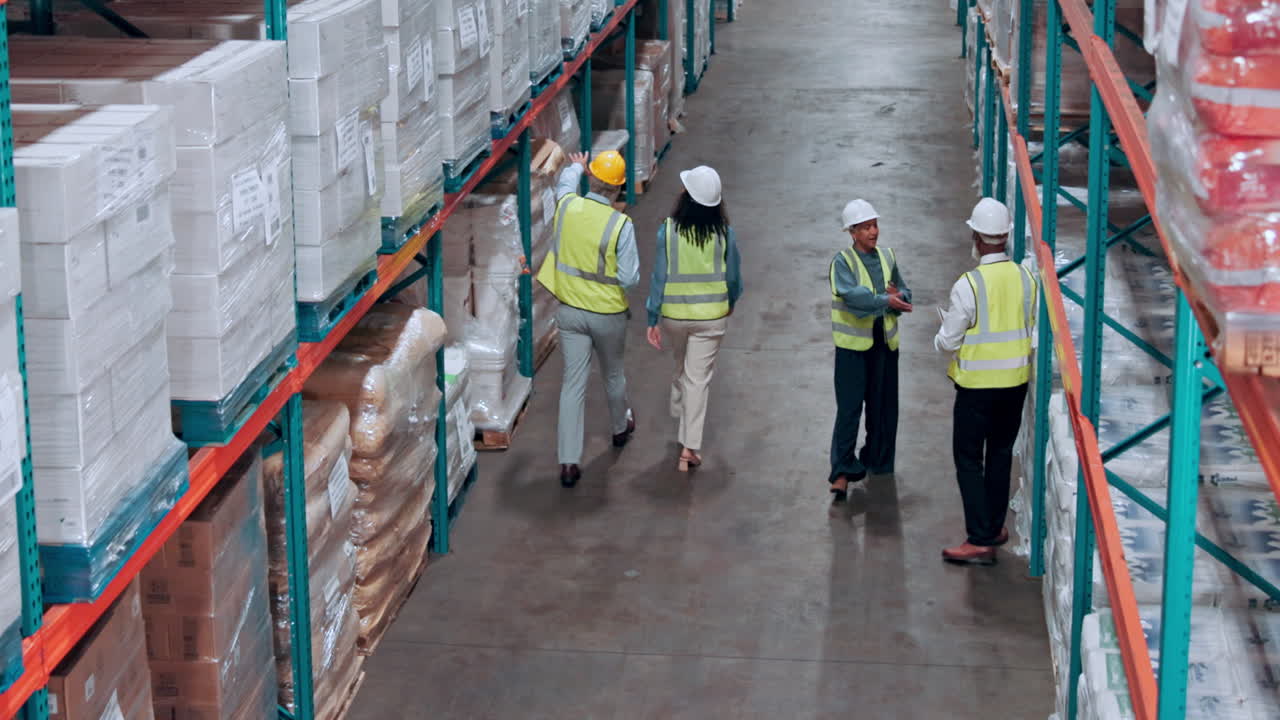 Diverse Team of Warehouse Workers Inspecting Inventory in a Large Facility