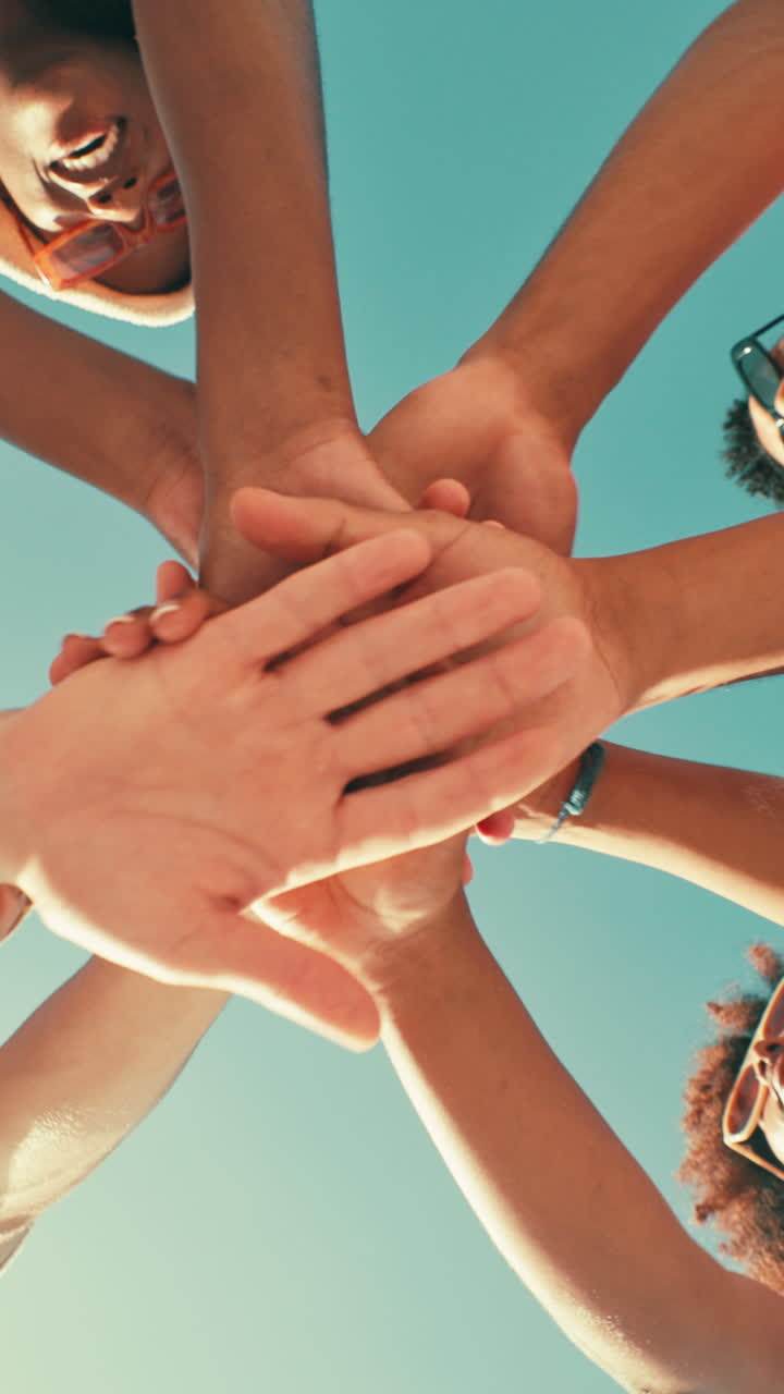 Diverse Group of Friends Huddling Hands Together for Teamwork