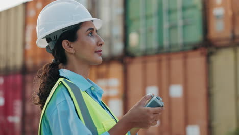 female engineer operating drone at port