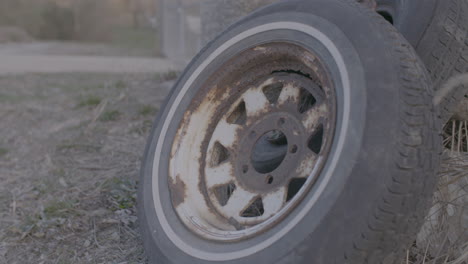 rusty rim and tire at a dump