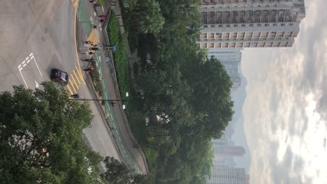 vertical footage of a busy crossing in tai po, hong kong