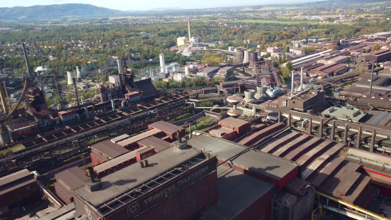 Steel factory in Trinec, Czech Republic, with large facility and industrial landscape view, grey brown roof top urban growth textures