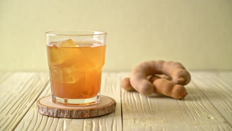 delicious sweet drink tamarind juice and ice cube - healthy drink style