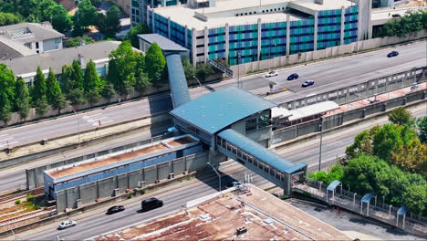 Bridge-of-train-station-over-american-highway-in-summer