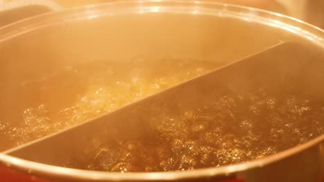 hot pot boiling with steam and broth