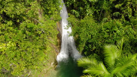 Aerial-shot-Inambakan-waterfalls-colourful-green-blue-water,-Cebu,-Philippines