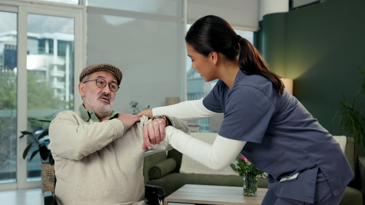 Caregiver assisting senior man with physical therapy