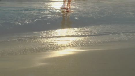 Animation-of-caucasian-woman-walking-on-beach-by-sea-over-landscape