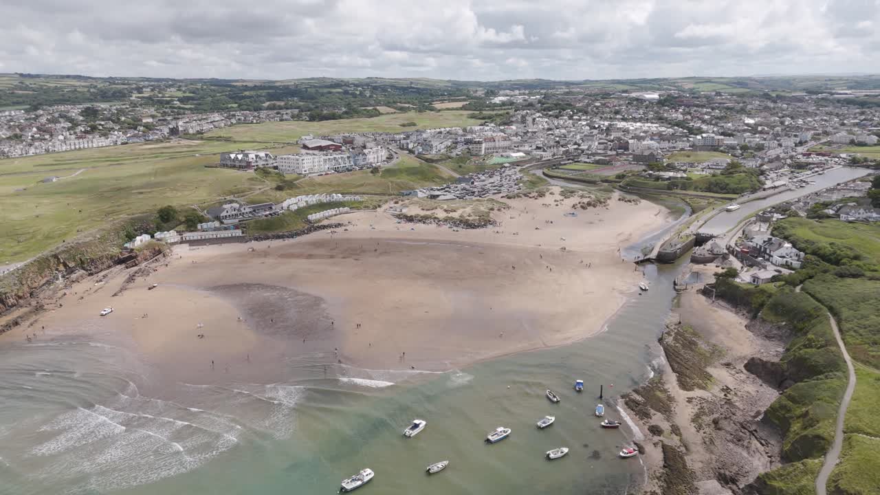Aerial View of a Coastal Town with Beach and Boats