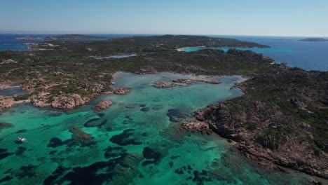 aerial panoramic view of sea of sardinia with turquoise sea and rocky coastal lines and untouched nature