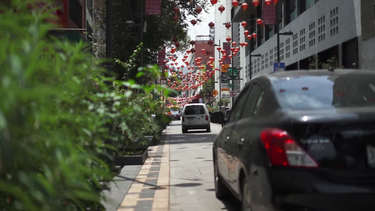 Cars Driving on a Street From Chinatown in Mexico City