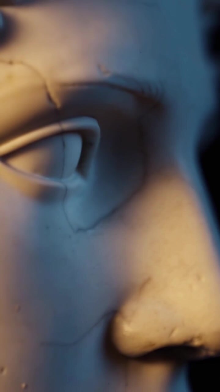 Close-up of Classical Marble Statue Face with Dramatic Lighting
