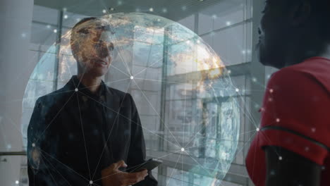 animation of globe and networks of connections over diverse business people talking in office