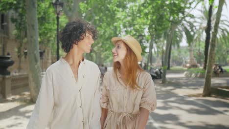 Portrait-of-tourist-couple-hugging-outdoor.-Man-and-woman-making-city-shopping