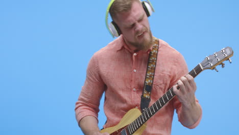 man playing electric guitar