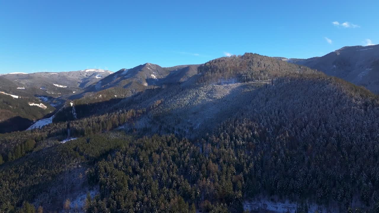 Forested Mountain During Winter In Styria, Austria. - aerial shot